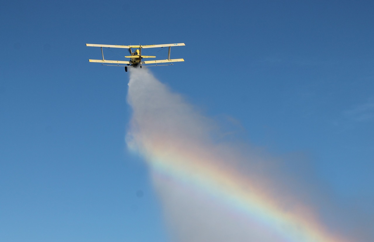 Image - eg cat crop duster dumping water