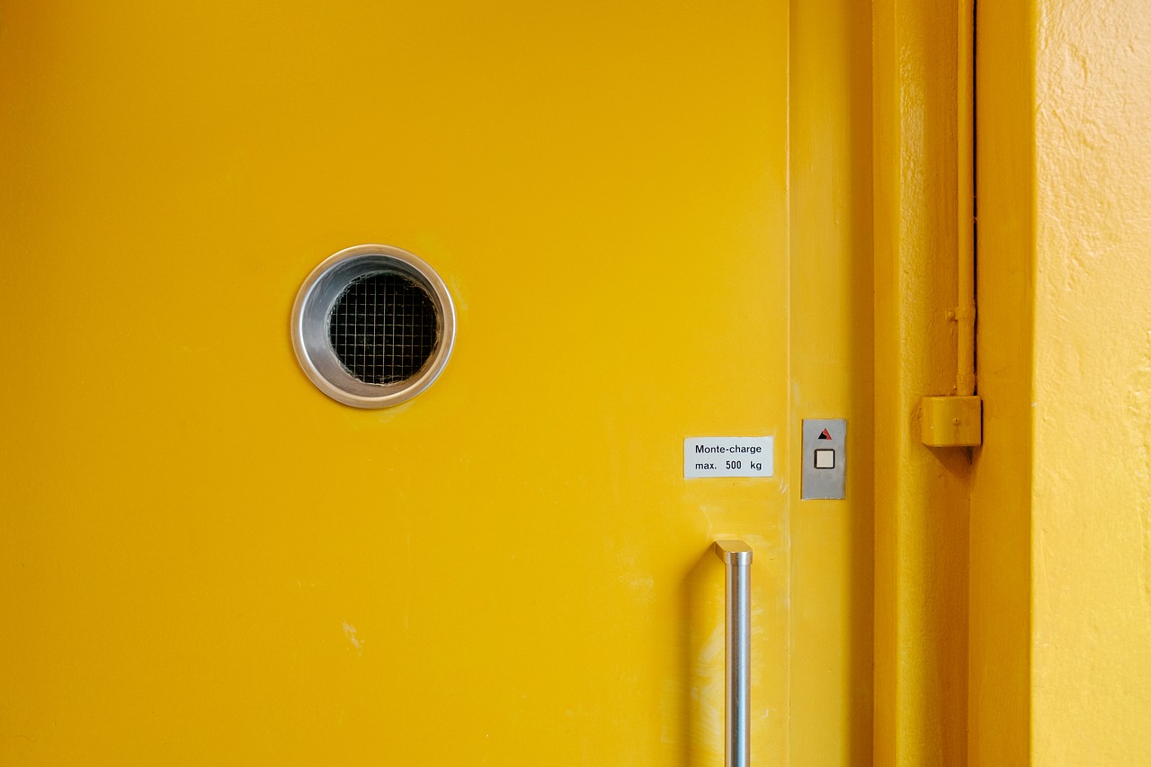 Image - yellow door hole