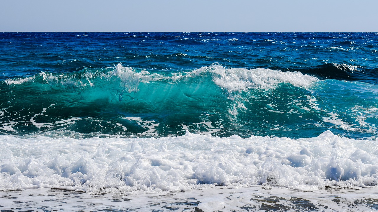 Image - shades of blue wave smashing foam