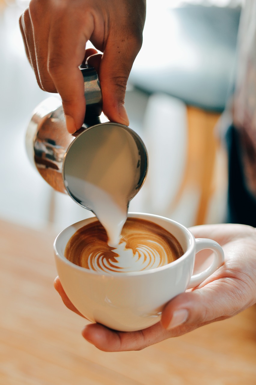 Image - hand palm steamed milk coffee