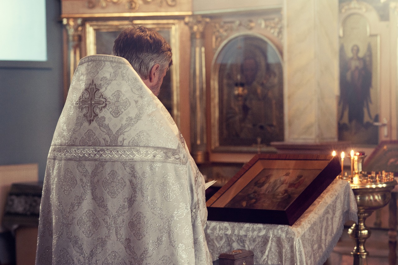 Image - priest back church holy candle