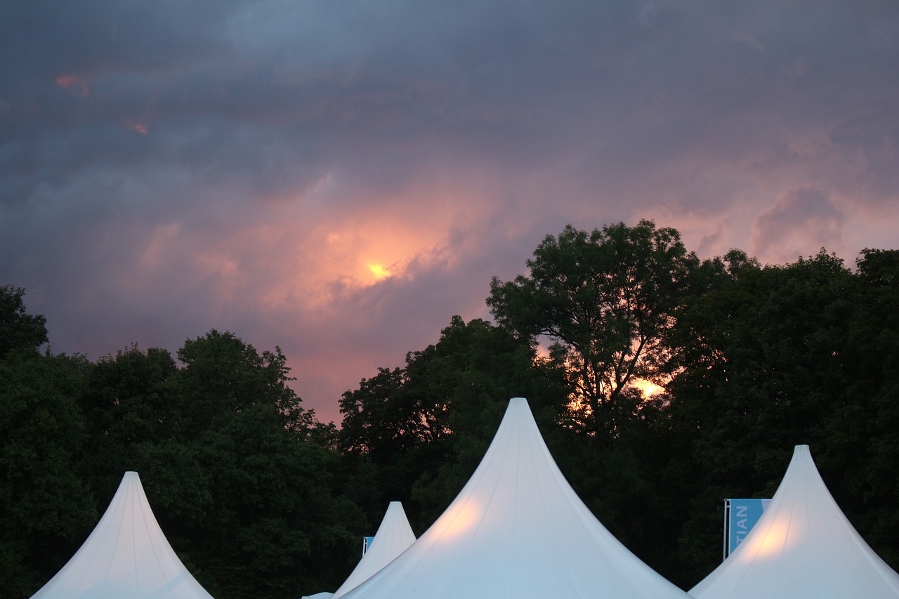 Image - sunset thunderstorm clouds tents