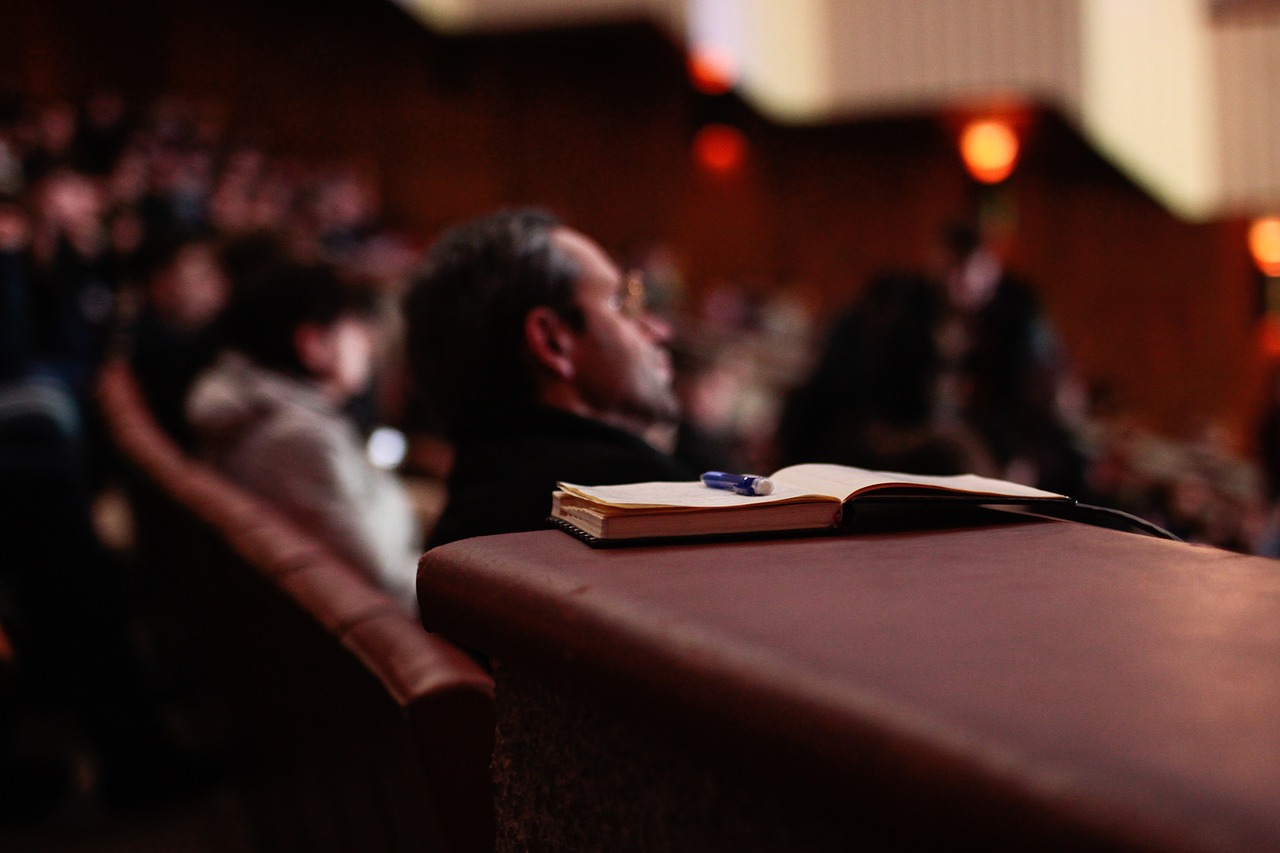 Image - book pen people auditorium seminar