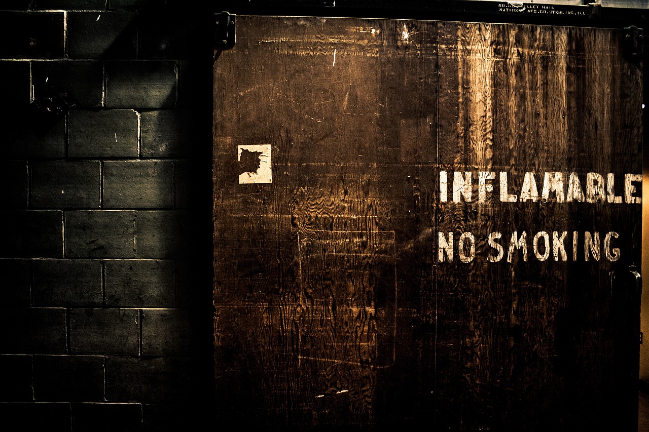 Image - caution sign wooden wall dark