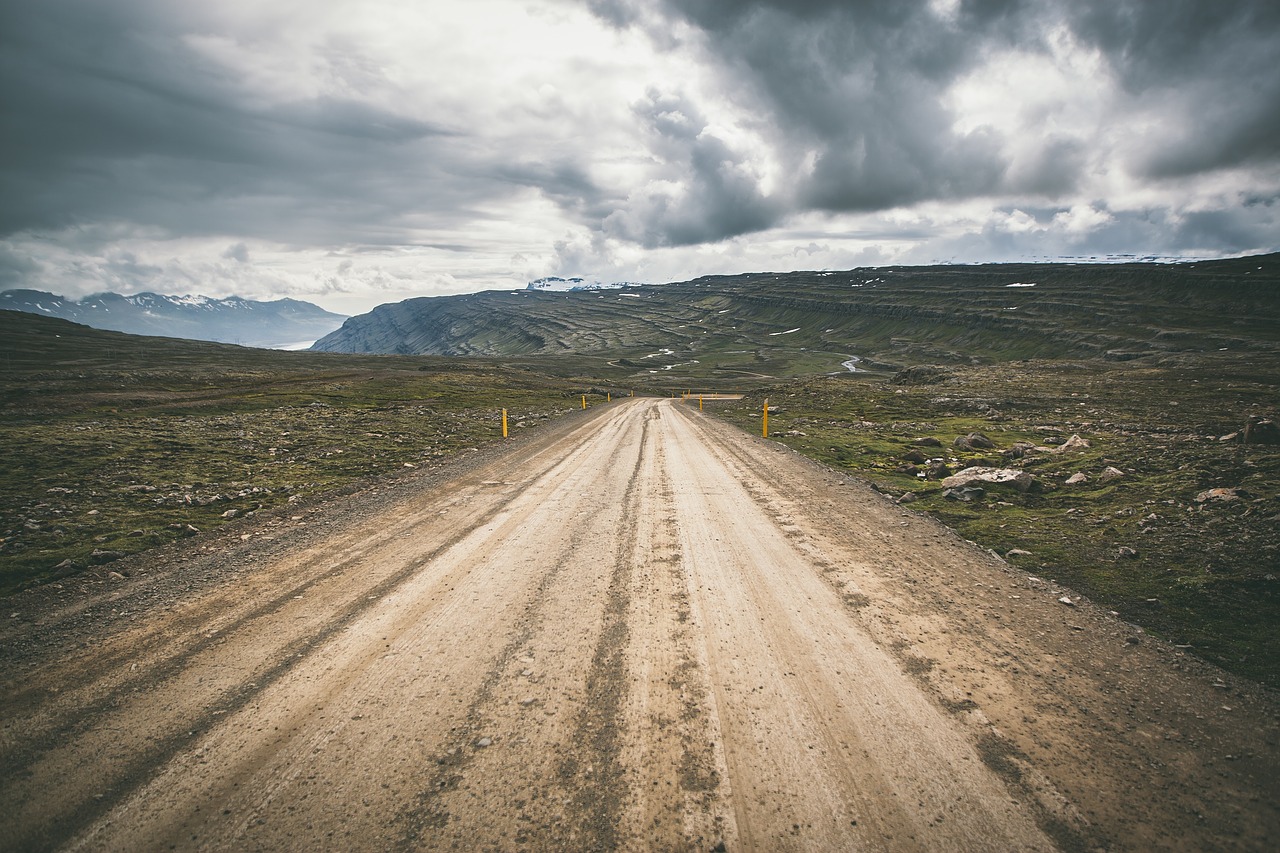 Image - cloudy sky road green grass rock