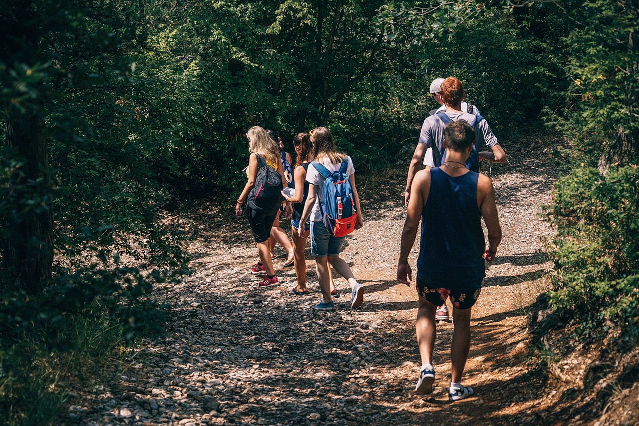 Image - people men women backpack walking