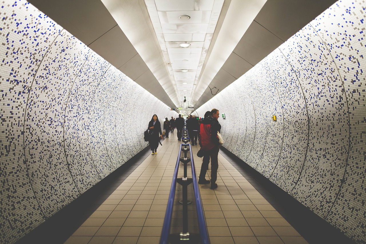 Image - people men women walking tunnel