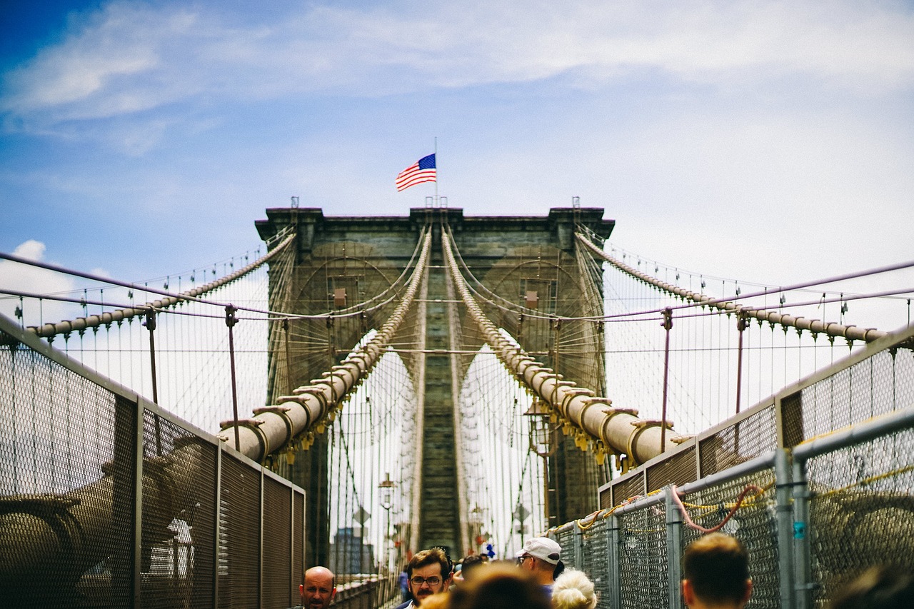 Image - people walking men bridge rope