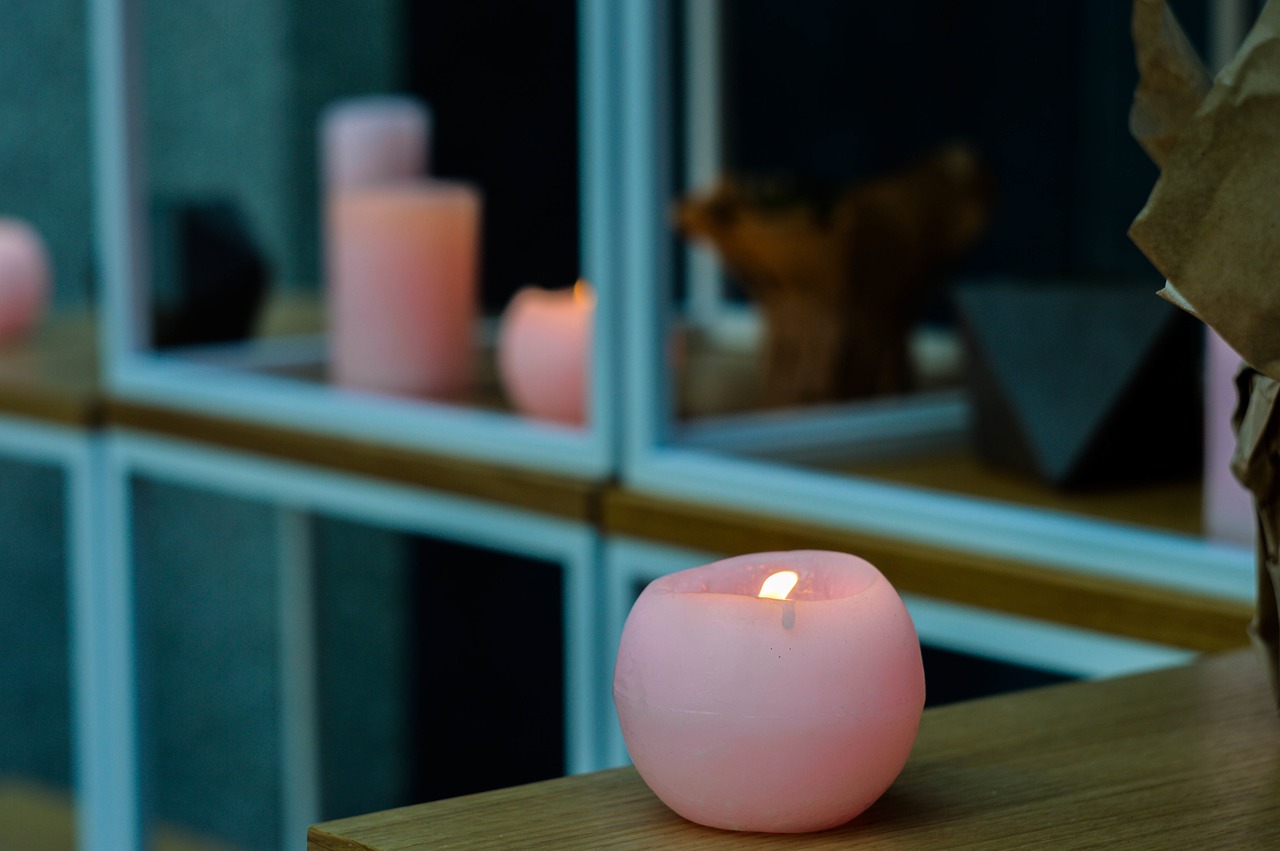 Image - lighting candle pink table window