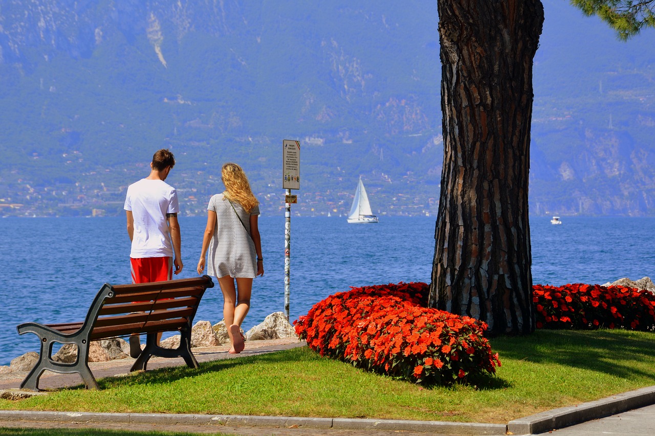 Image - couple lake bench flowers