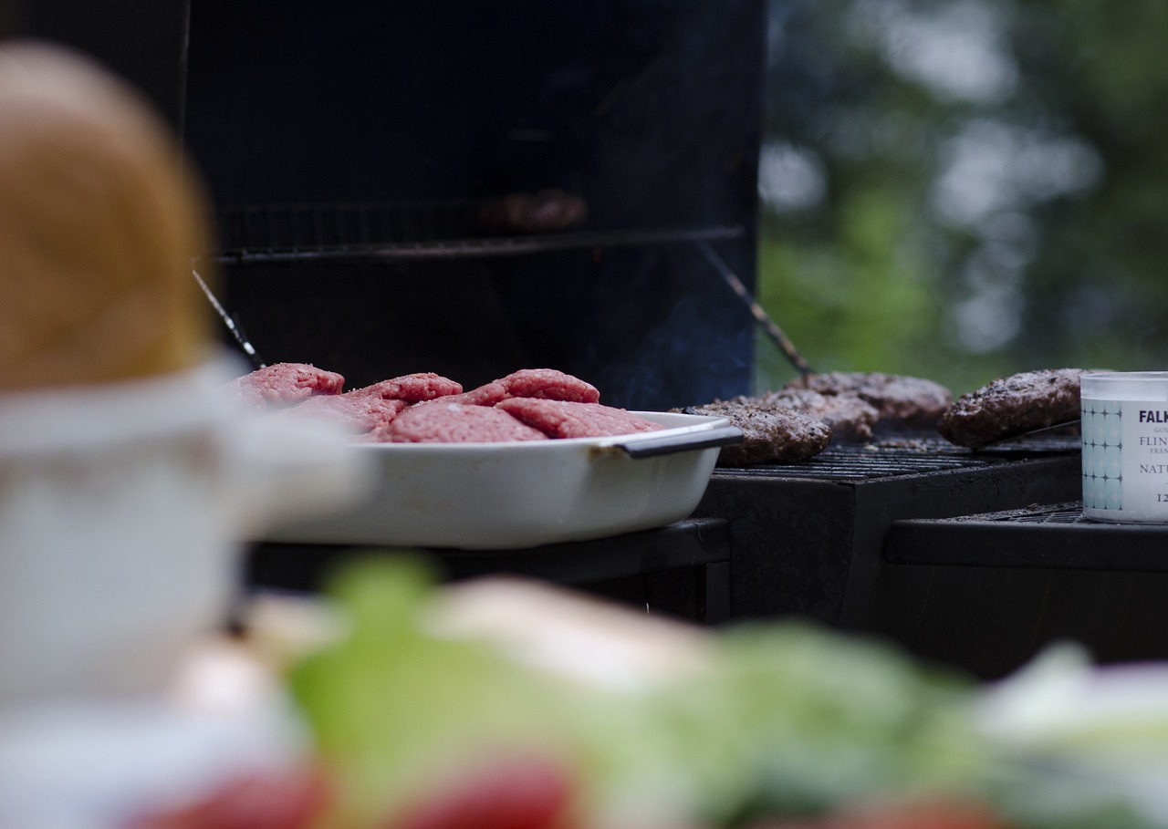 Image - grilling meat burgers salad tomato