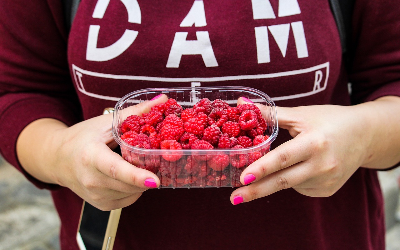Image - raspberries fruits container hands