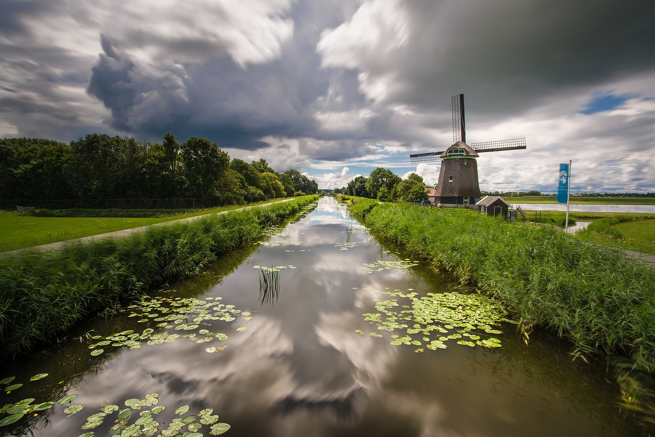 Image - clouds water windmill channel