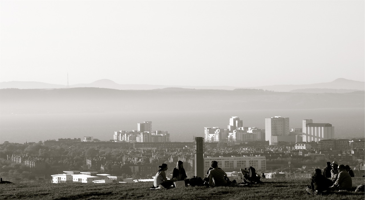 Image - people sitting grass city