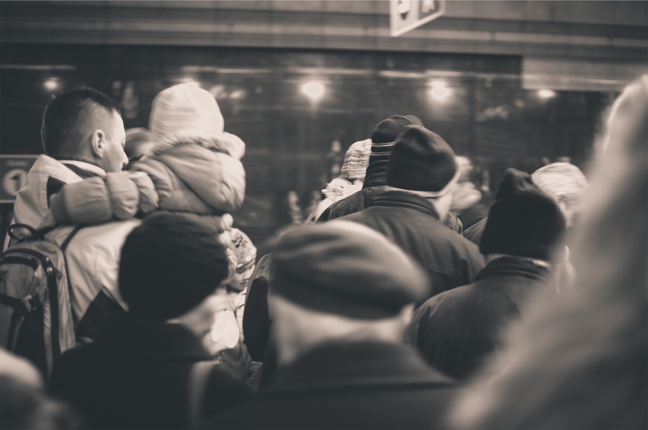 Image - people crowd subway winter coats