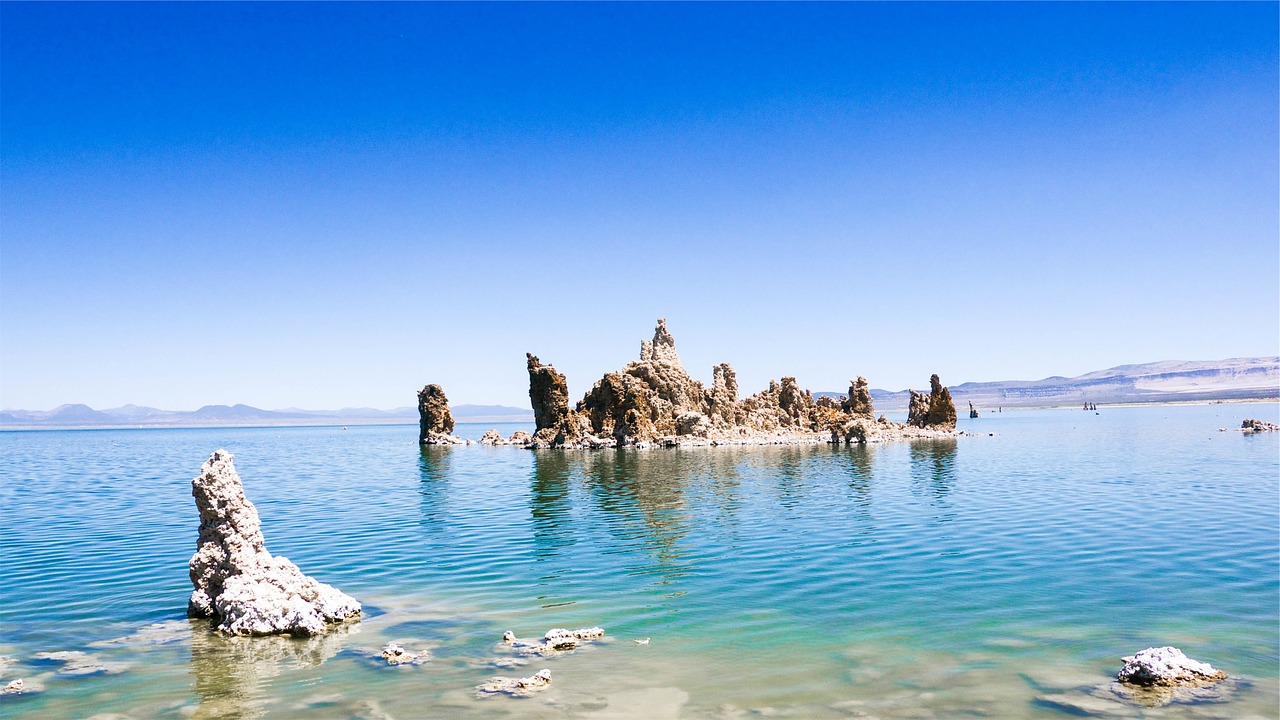 Image - lake water blue sky rocks shore