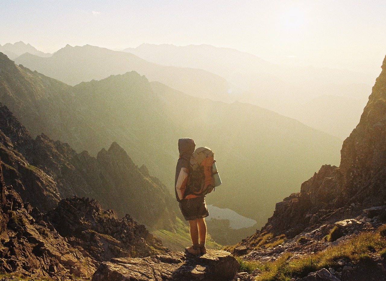 Image - sky sun mountains cliff hiker