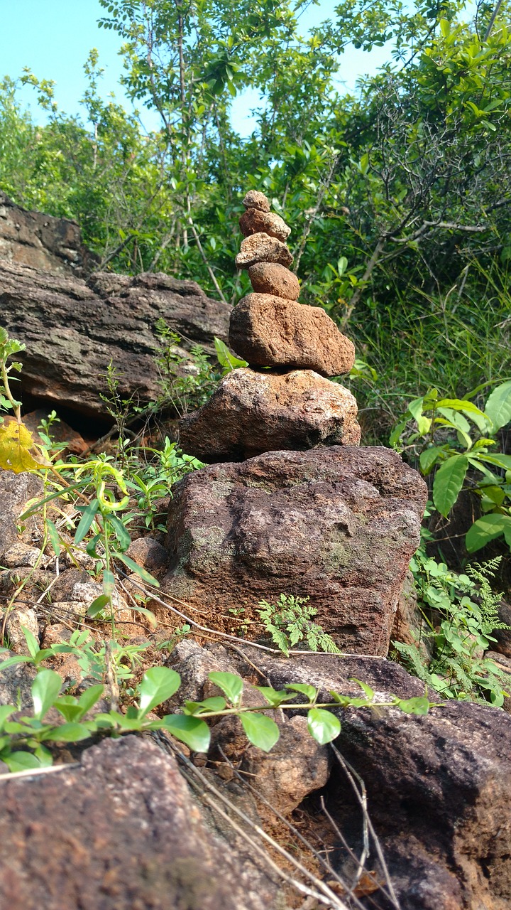 Image - stone balancing hills tress