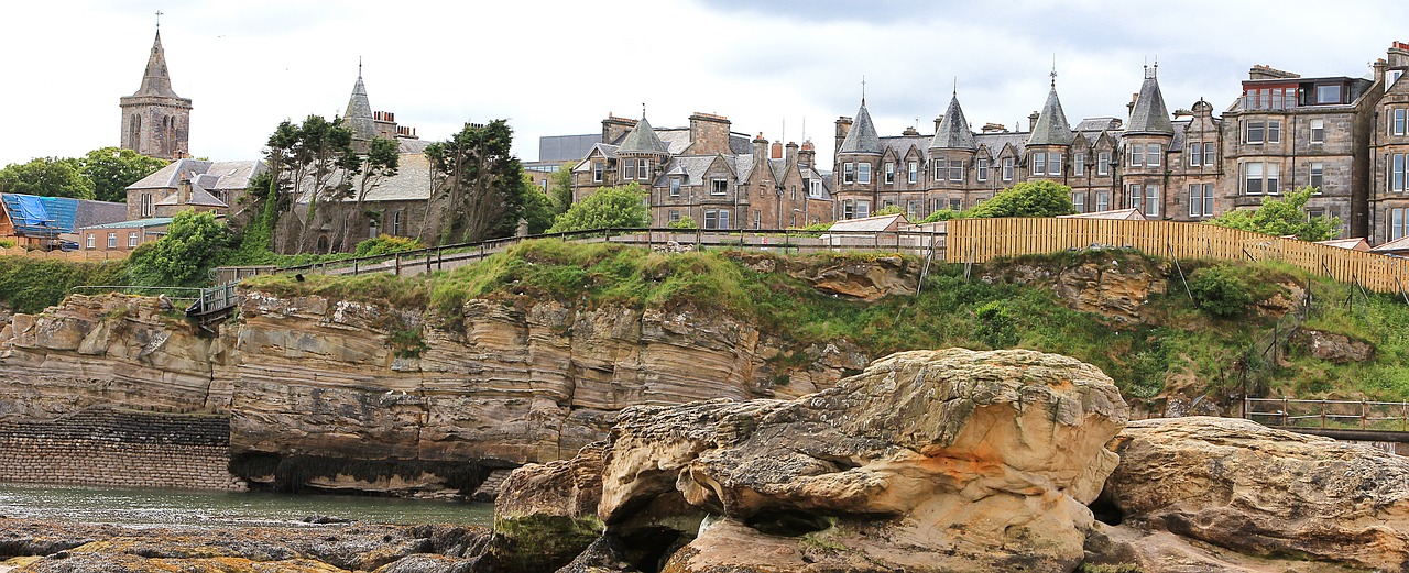 Image - city cliff sea beach homes church