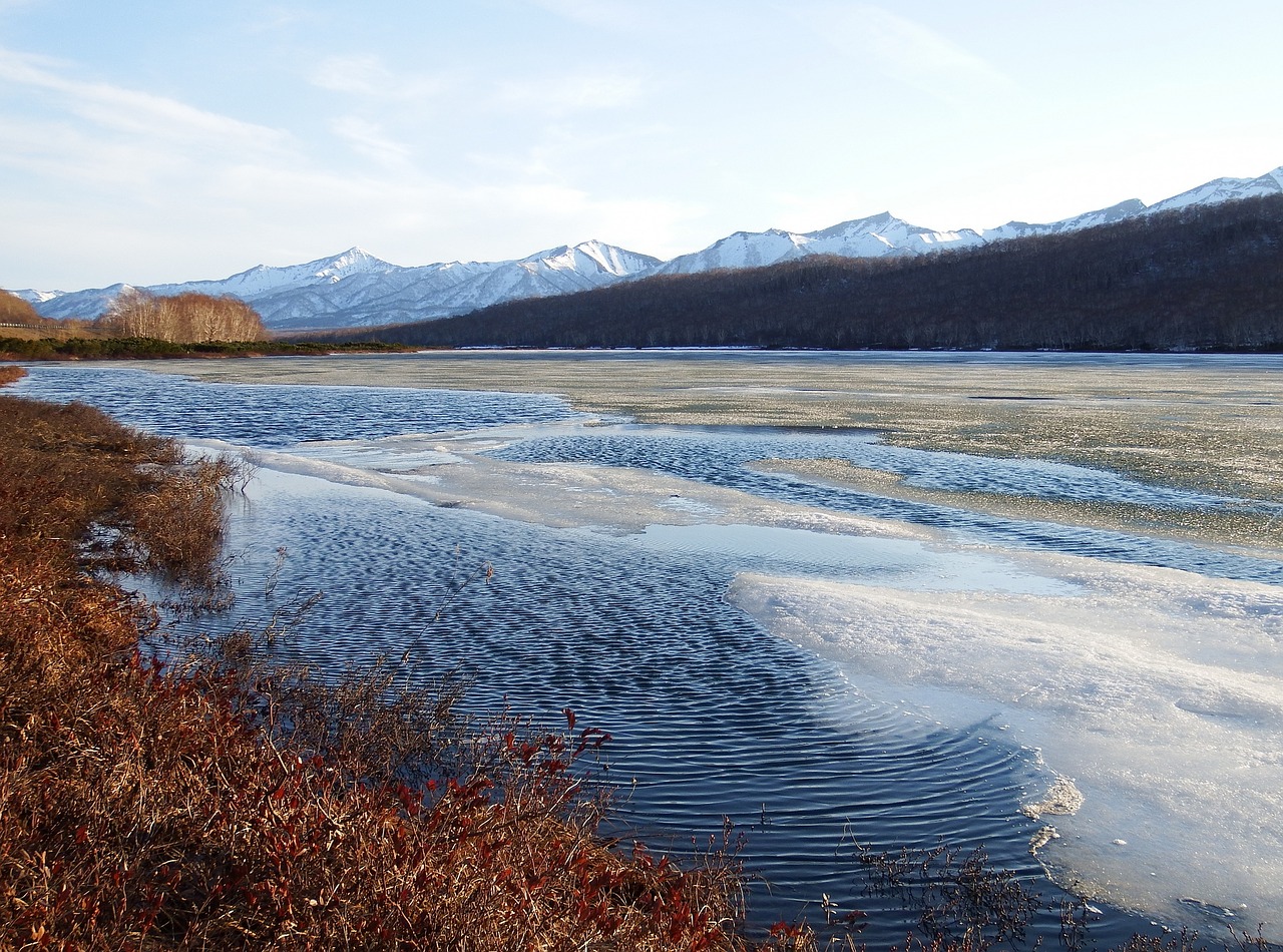 Image - spring lake ice mountains sky