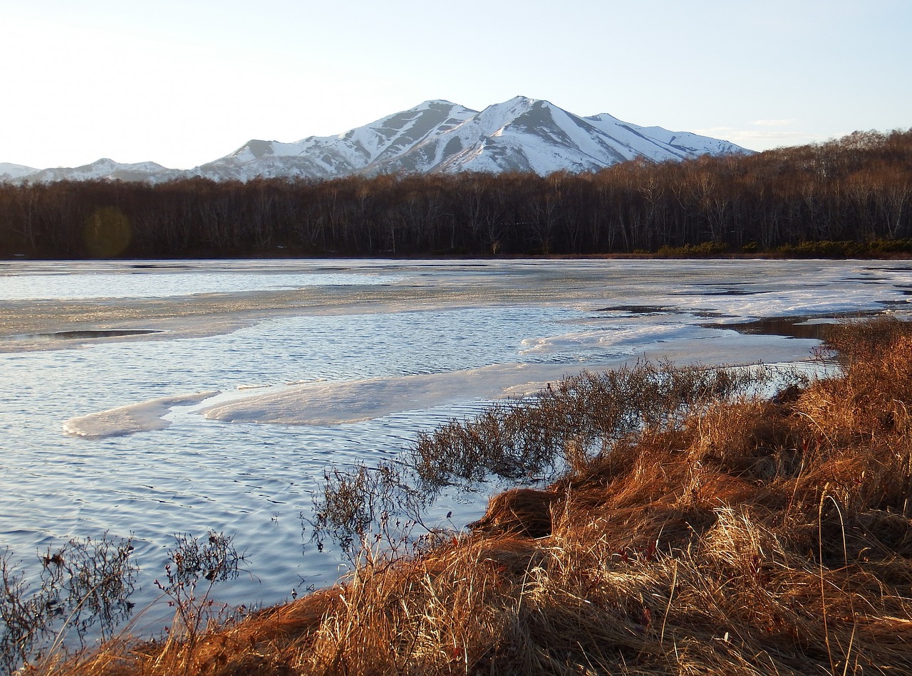 Image - spring lake ice mountains sky
