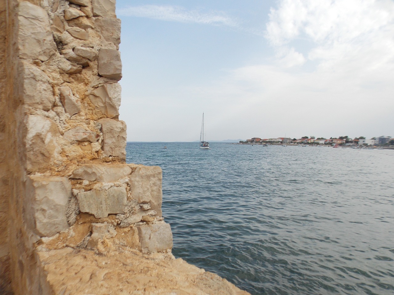 Image - stone wall sea blue sky sailing