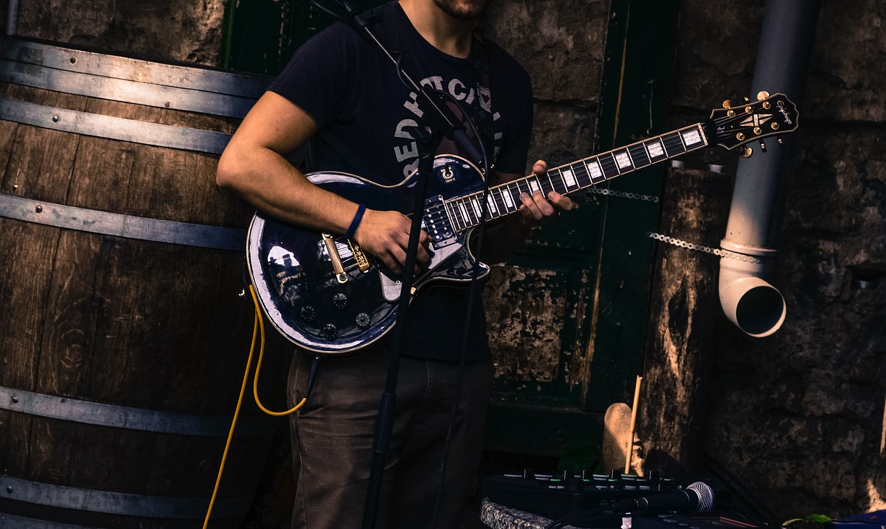Image - guitar player street busker player