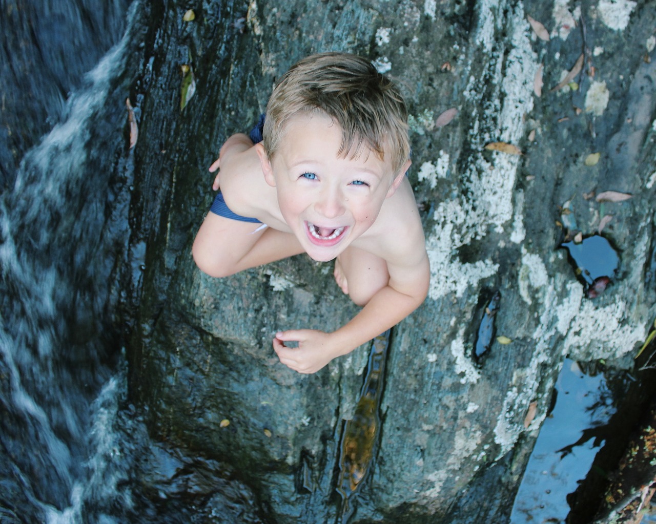 Image - boy blue eyes river rocks