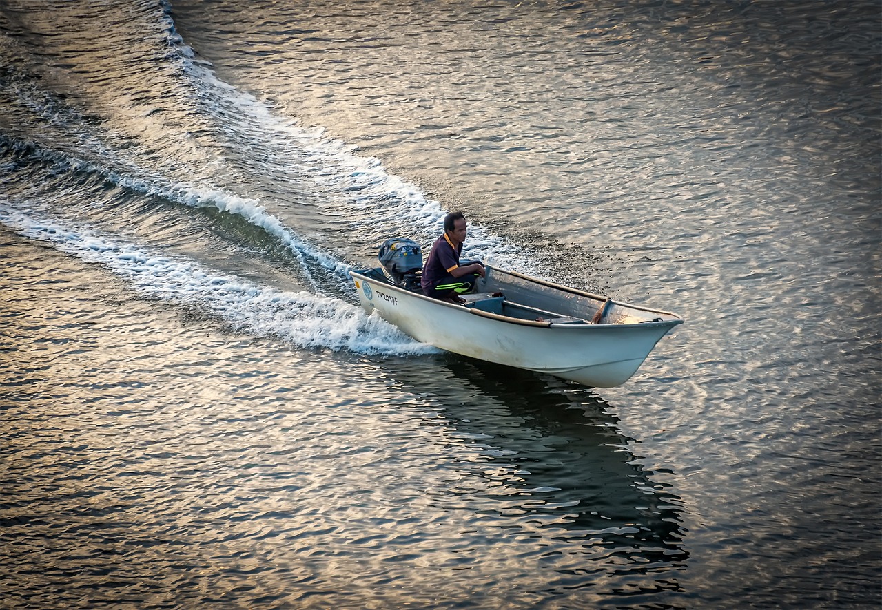 Image - boat man water male person river