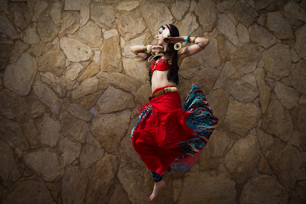 Image - women jump dance photo red tribal