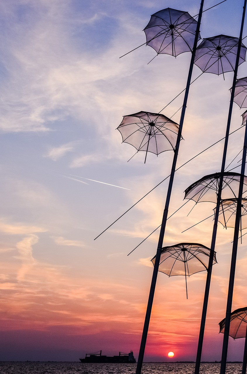 Image - umbrellas art sculpture sunset