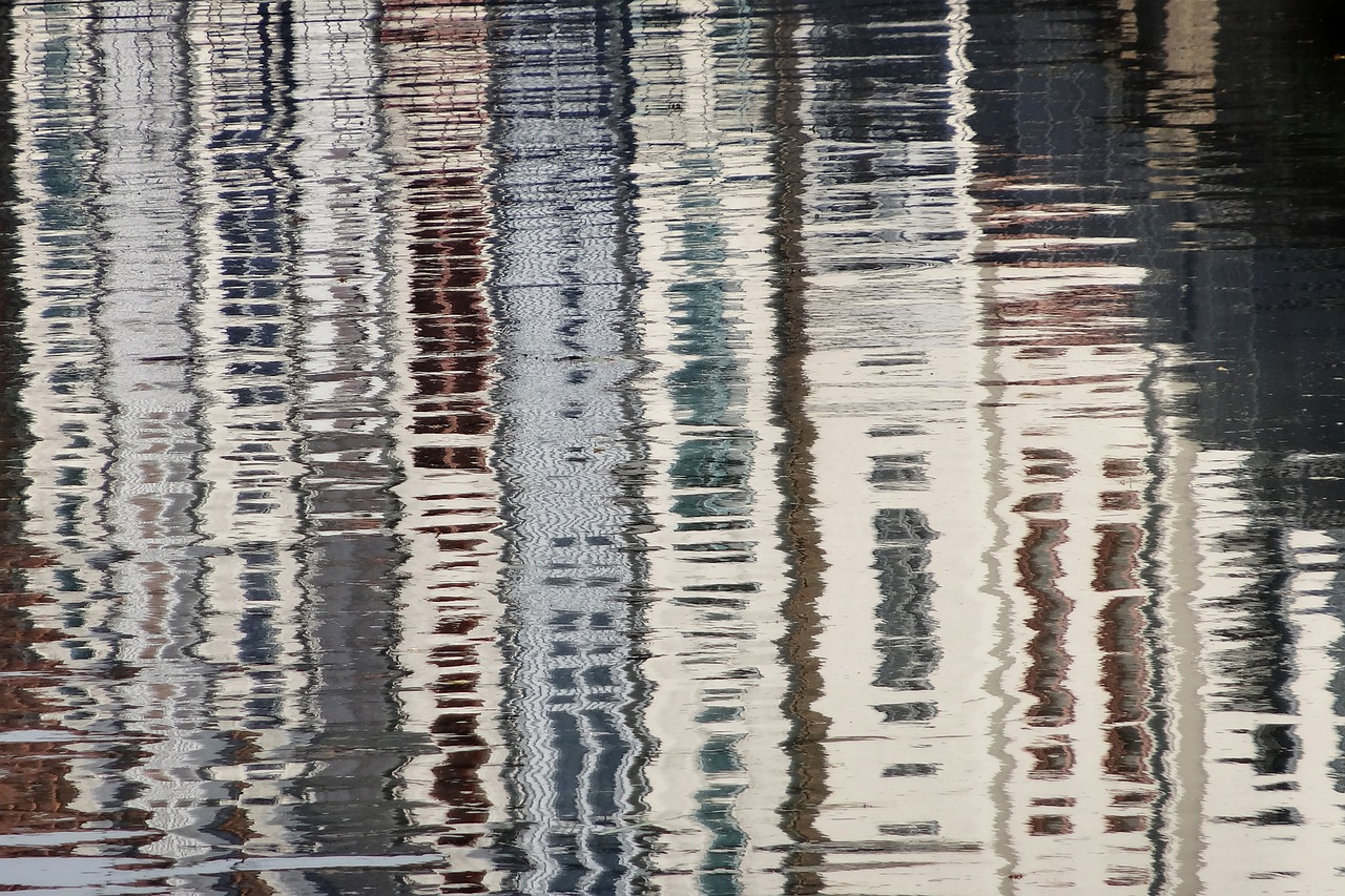 Image - reflections houses channel water