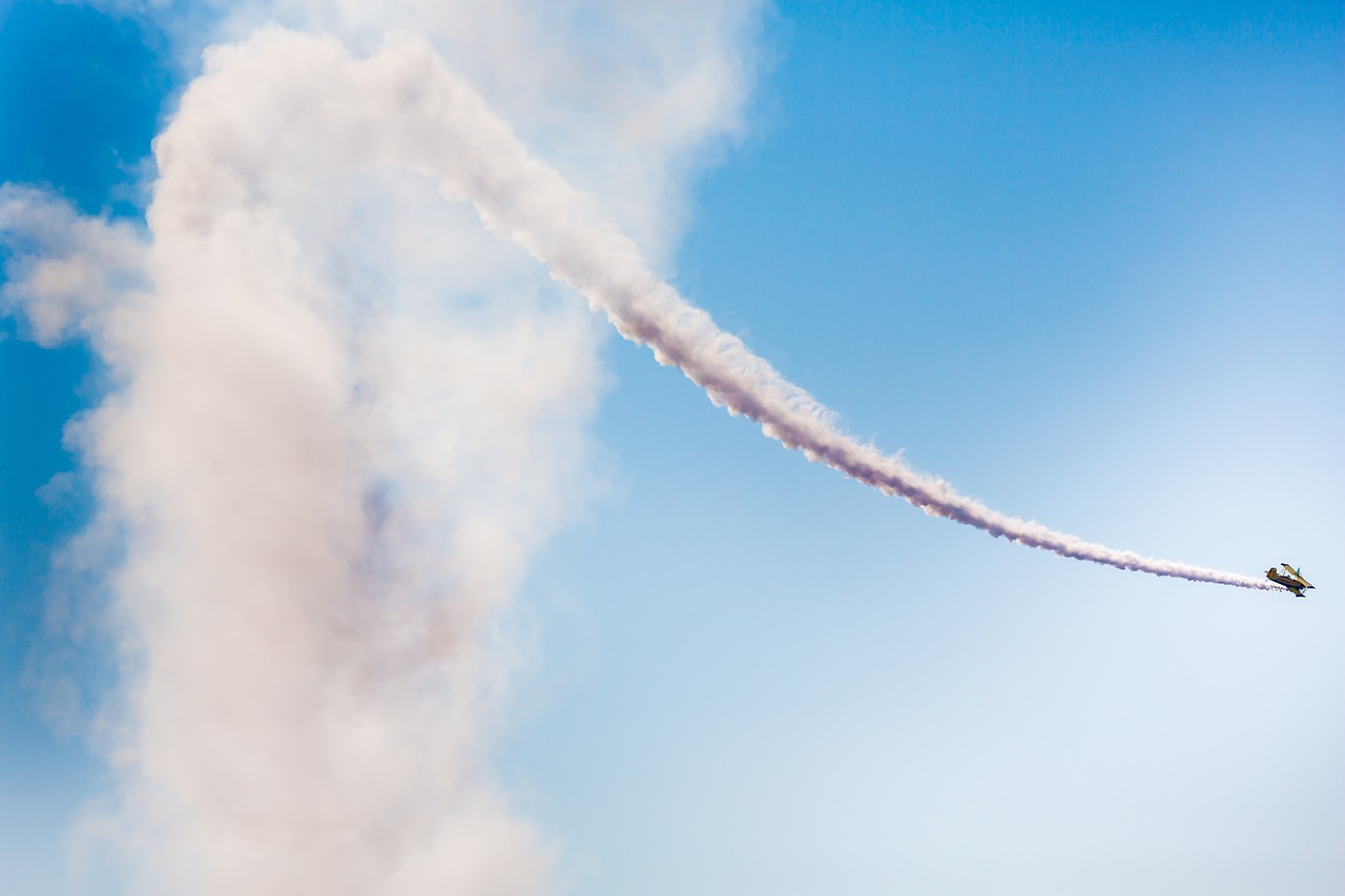 Image - aerobatic plane smoke cloud sky