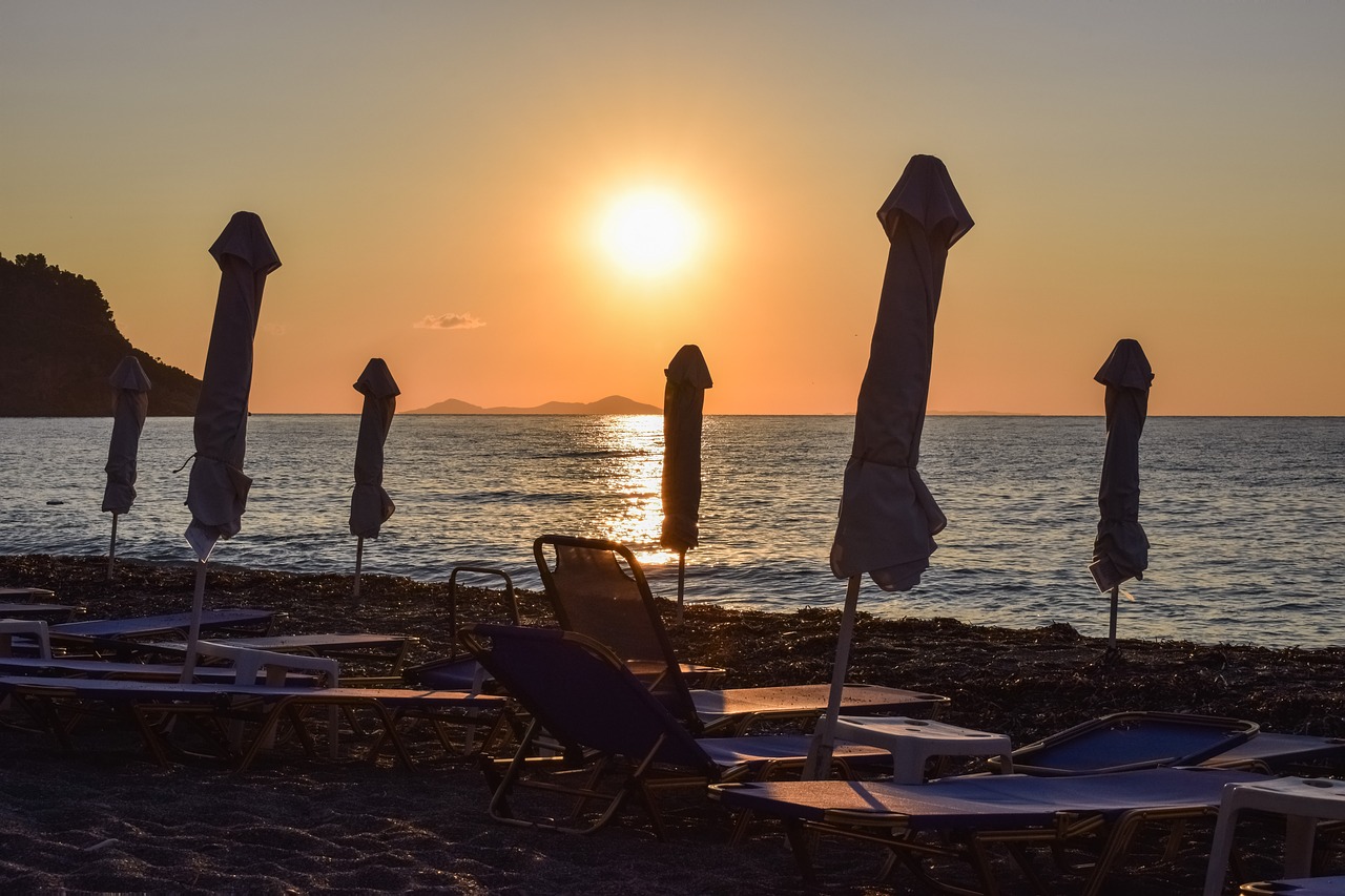 Image - beach umbrellas summer sun sunrise