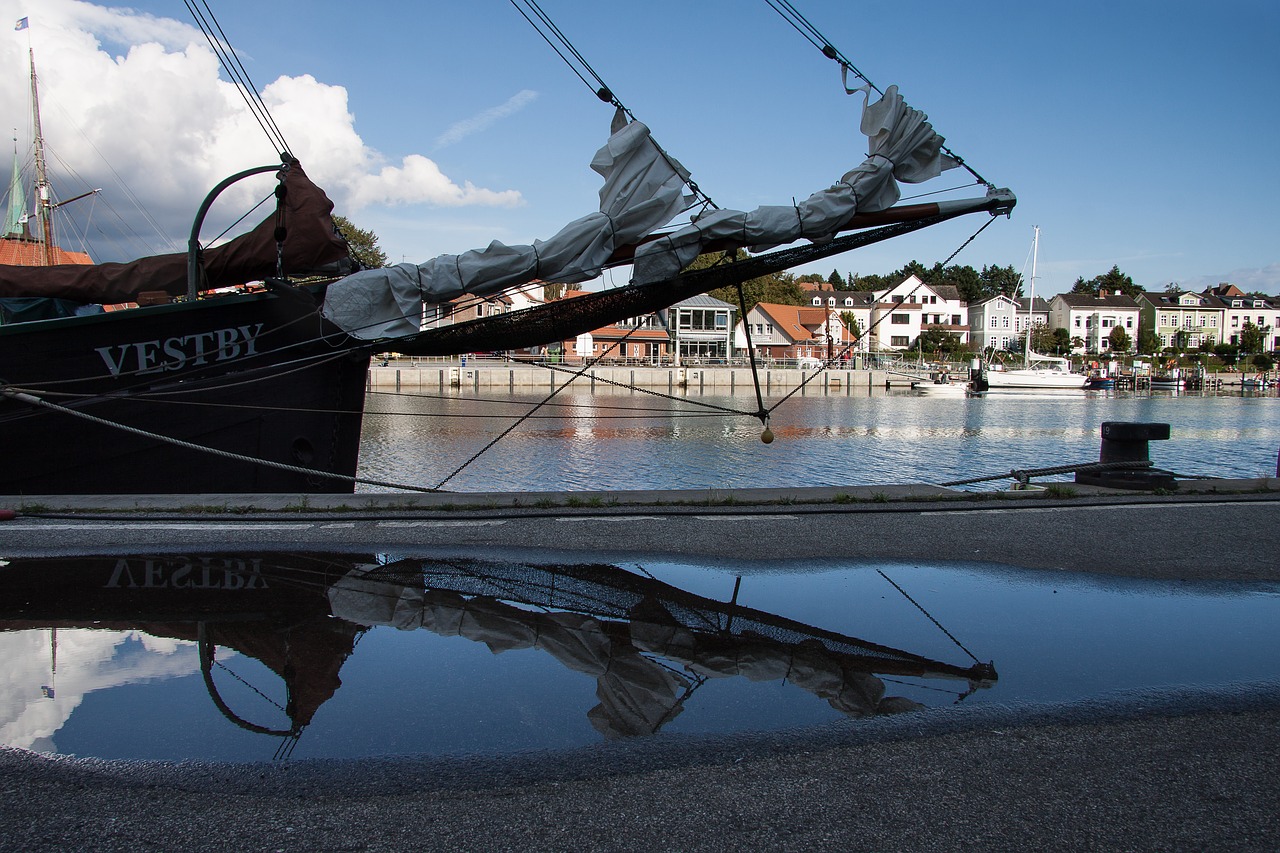 Image - puddle mirroring water ship