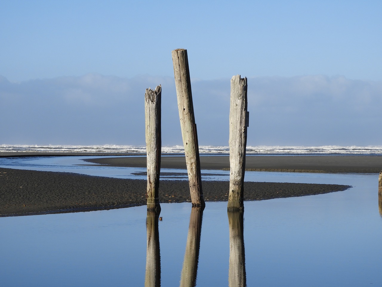 Image - beach sea piling sky coast