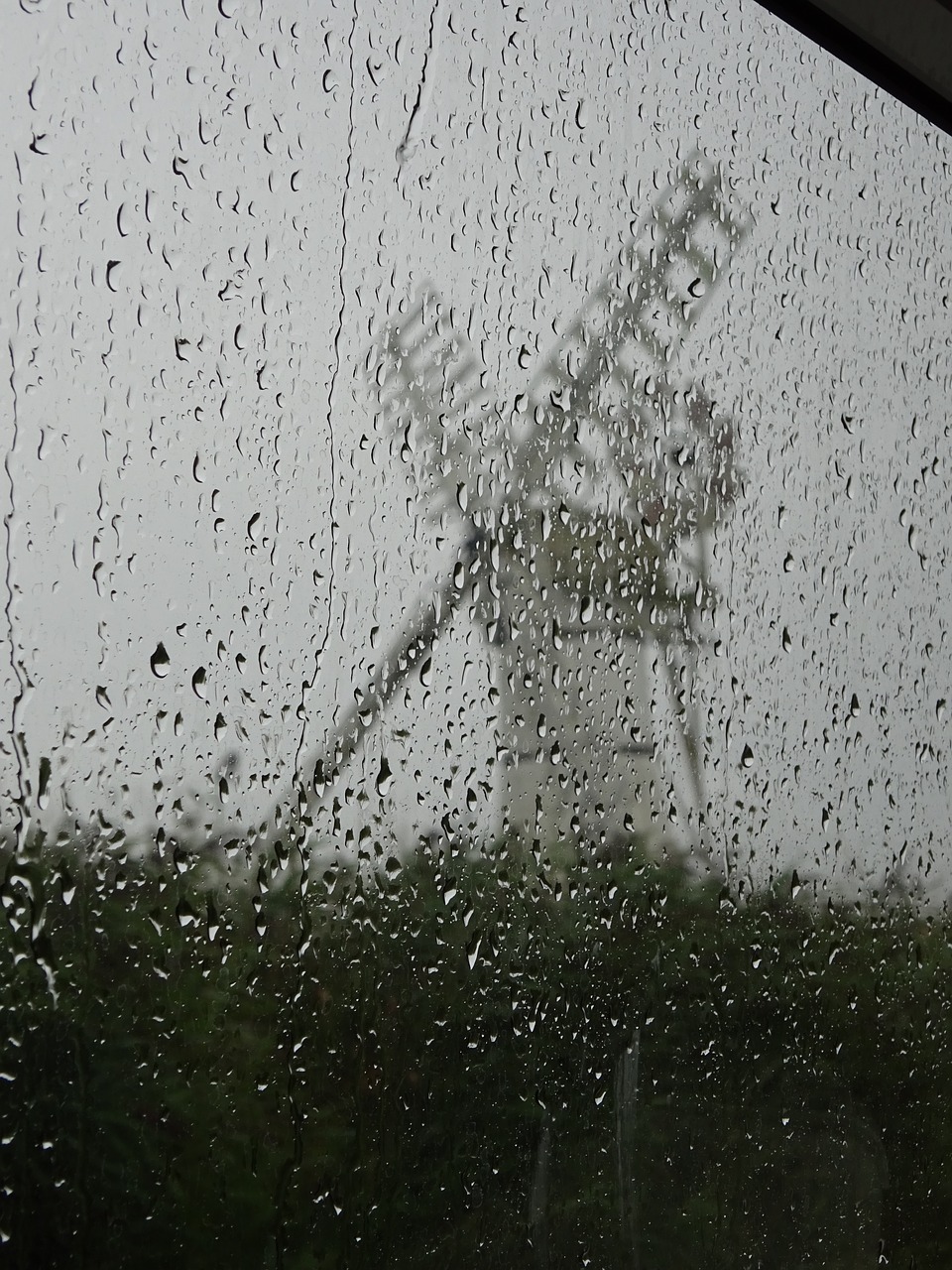 Image - windmill white windmill rainy day