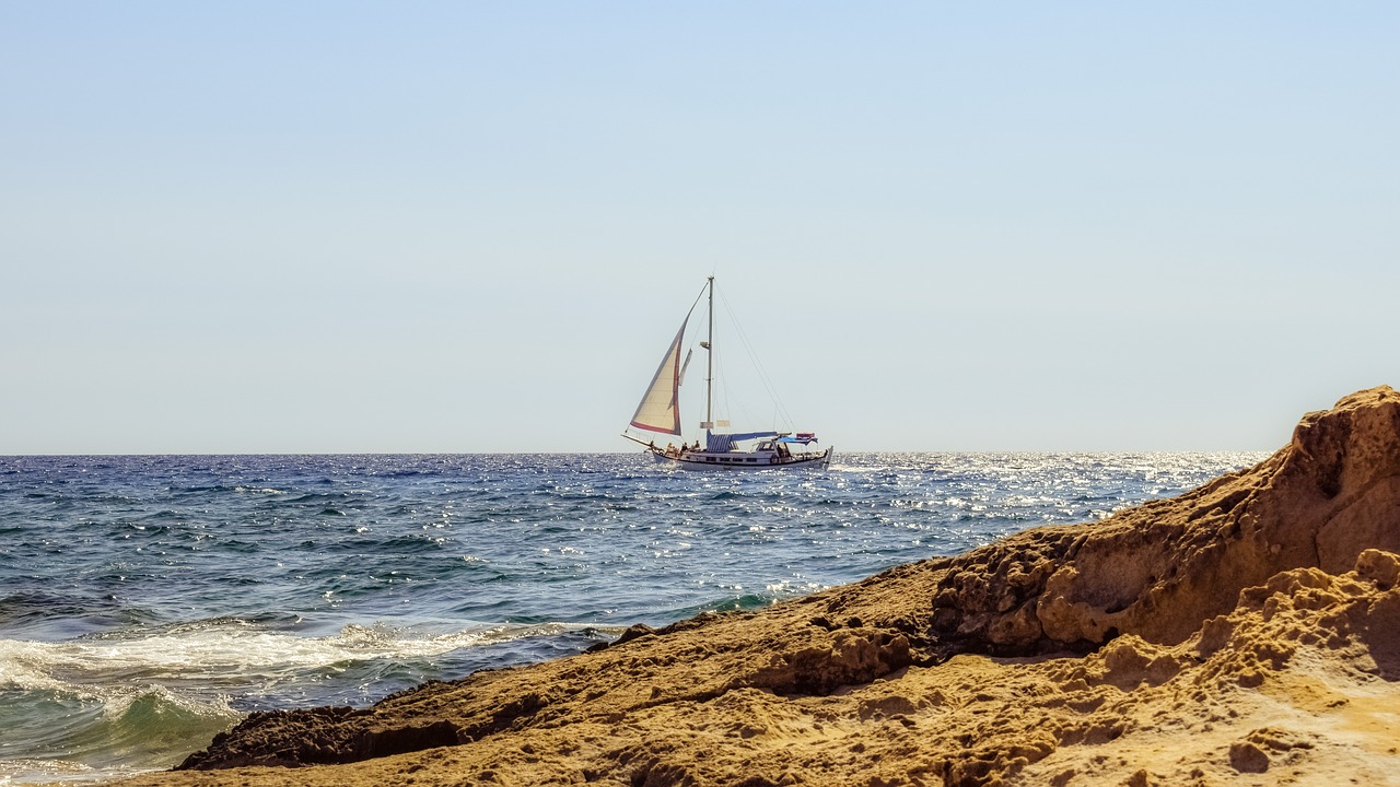 Image - boat sea rocky coast autumn