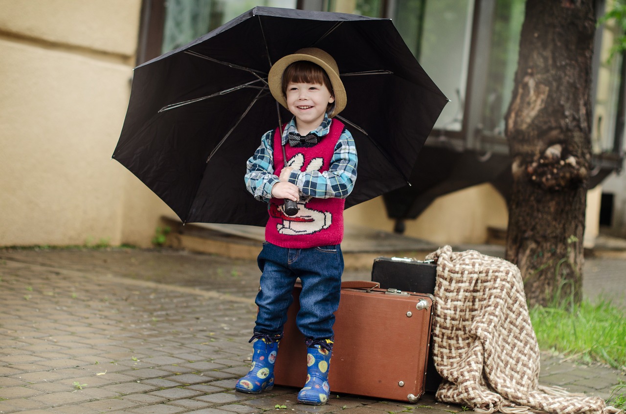 Image - suitcase rain street wet weather