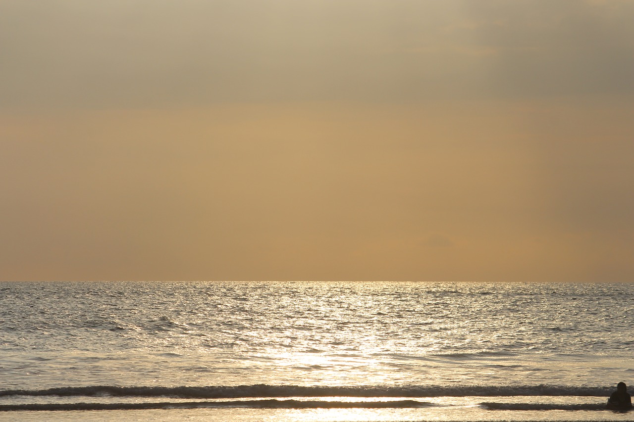 Image - beach sun raining clouds sunny day