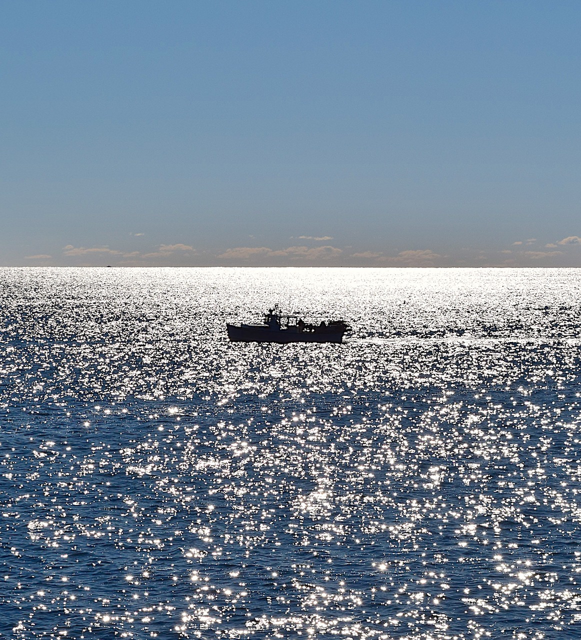 Image - boat ocean sunlight sparkle water