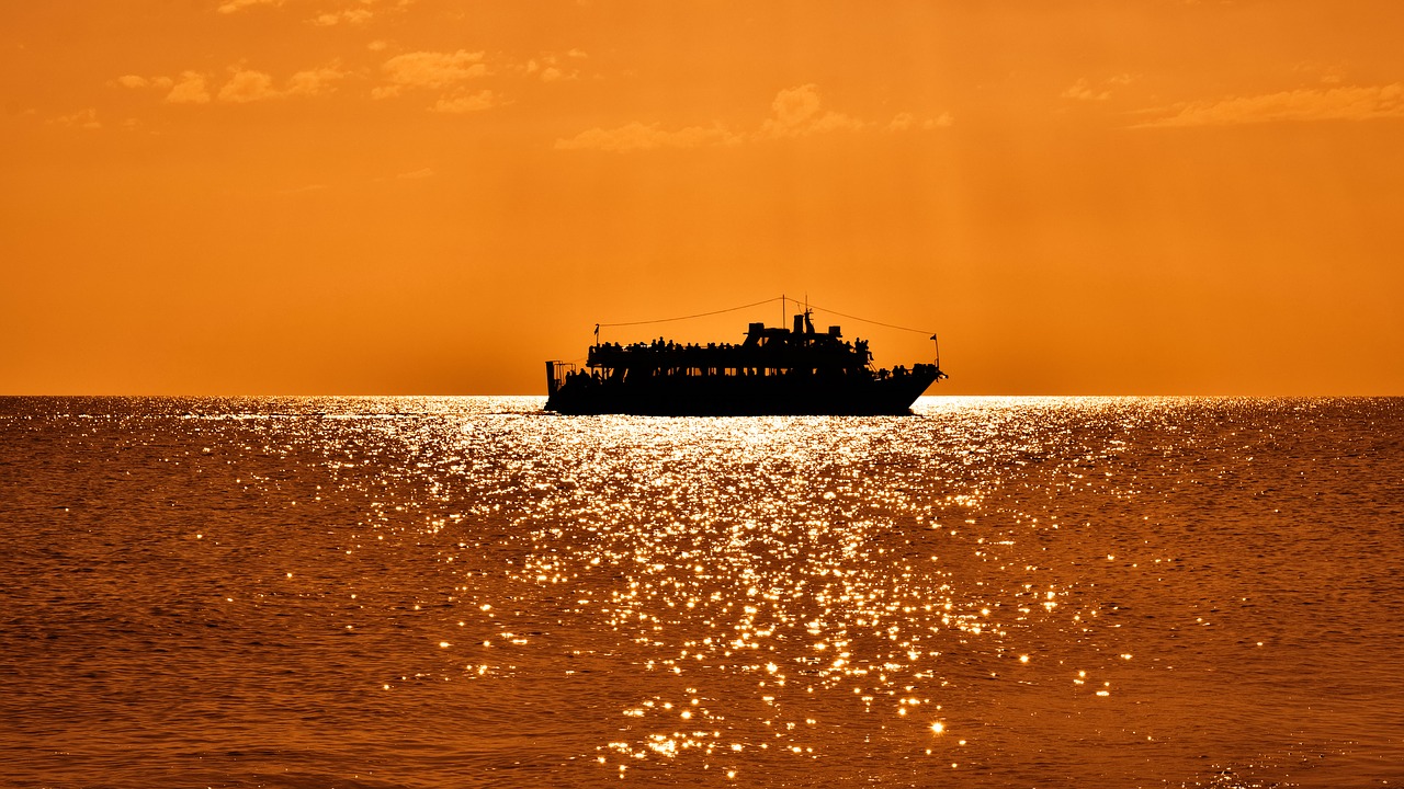 Image - boat sunset sunlight sunbeam sea