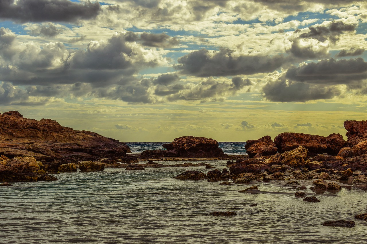 Image - rocky coast sea waves sky clouds