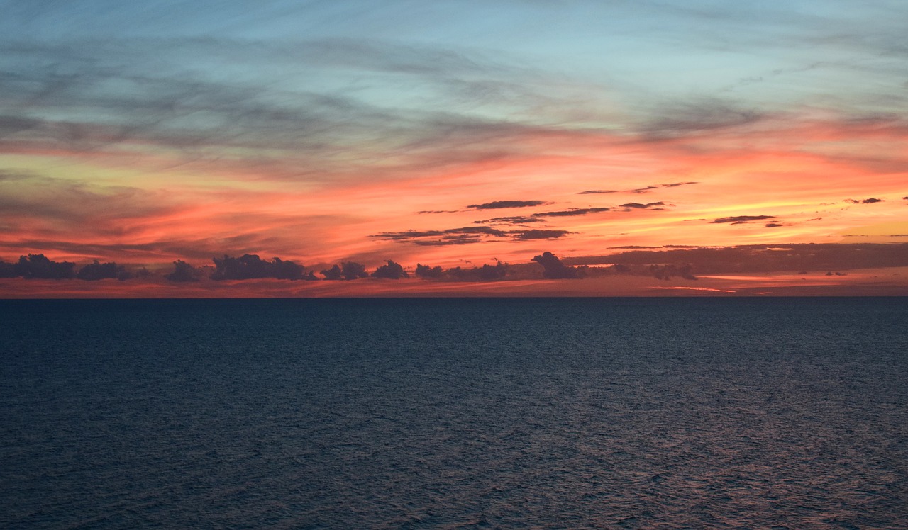 Image - sunset over the water travel