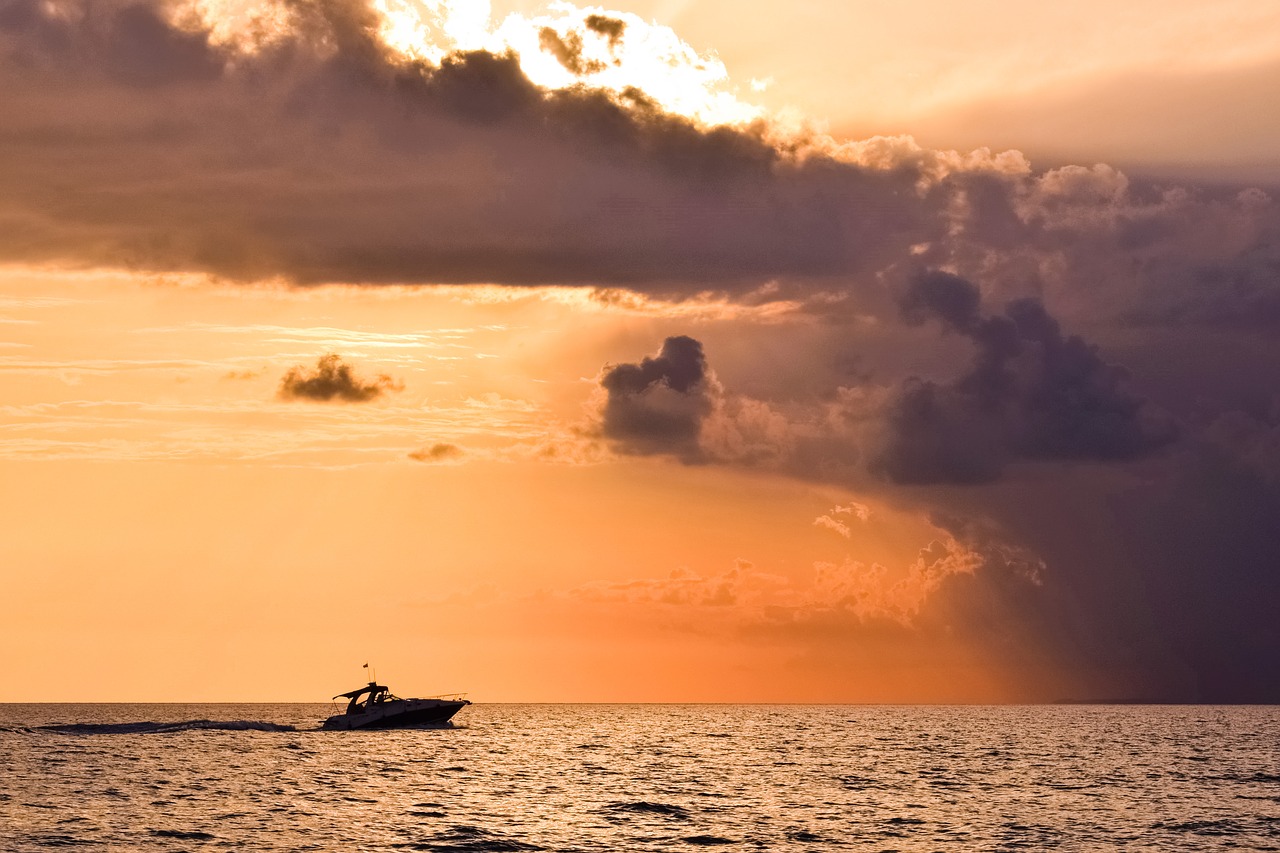 Image - storm sunset boat sky clouds