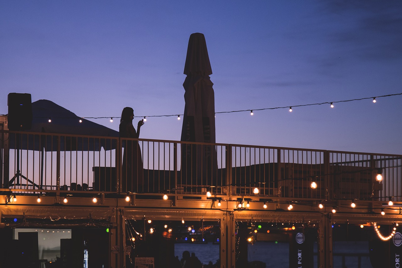 Image - people balcony bar dusk evening
