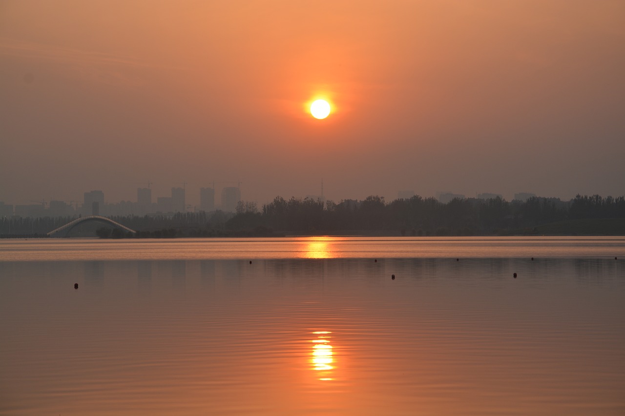 Image - sunset sun lake the city city