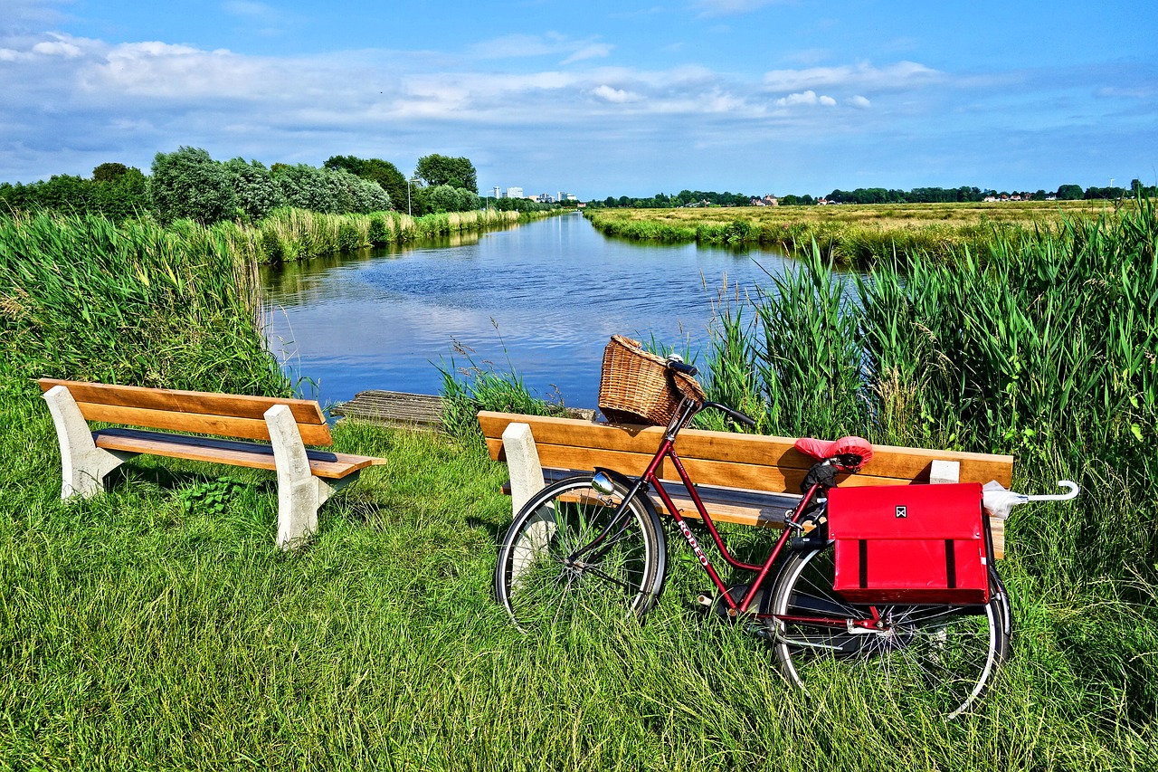 Image - bicycle bench waterway field