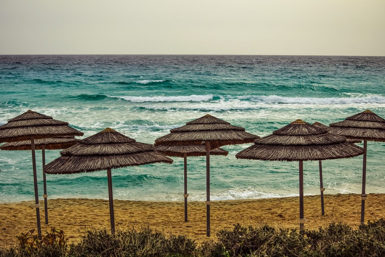 Image - seashore beach empty sea umbrellas