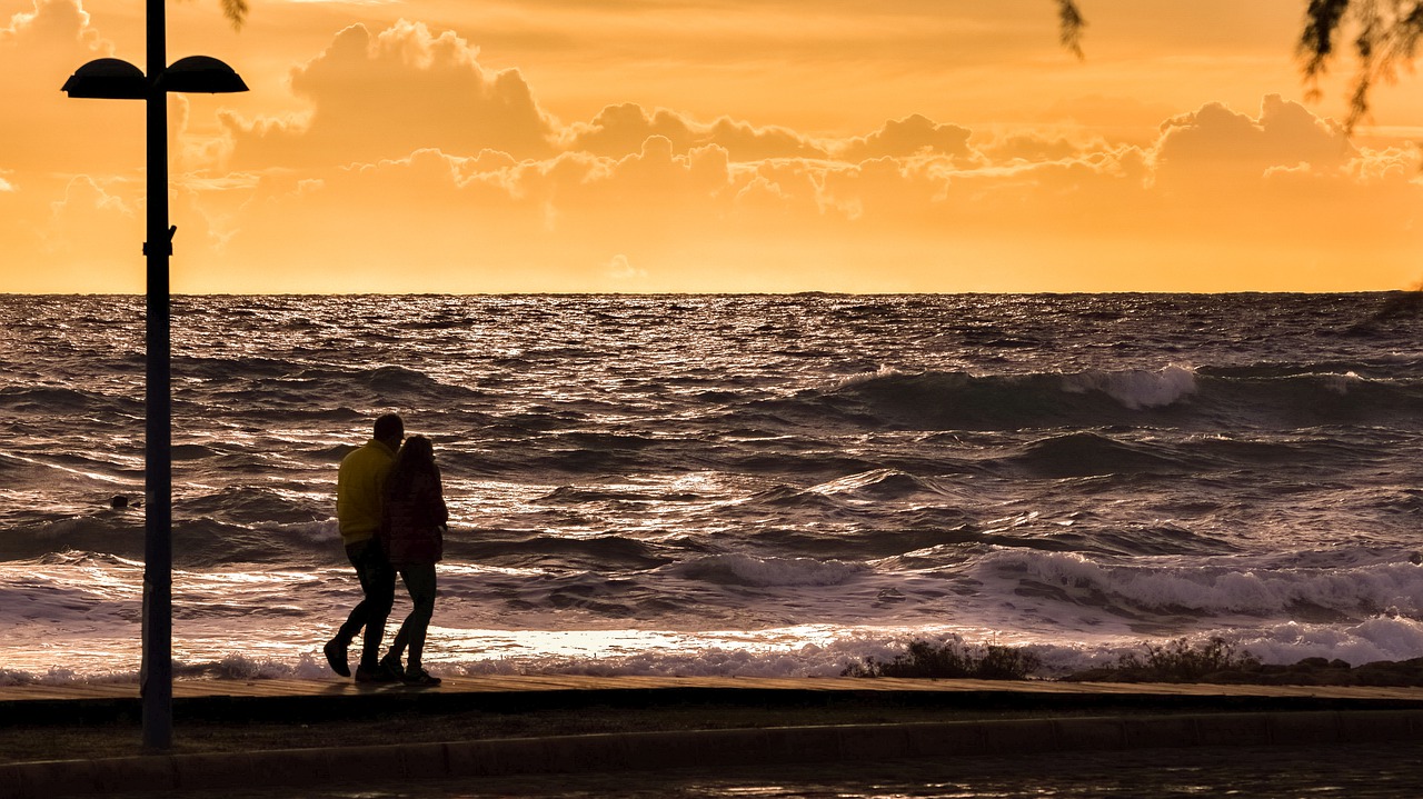 Image - sunset sea promenade couple